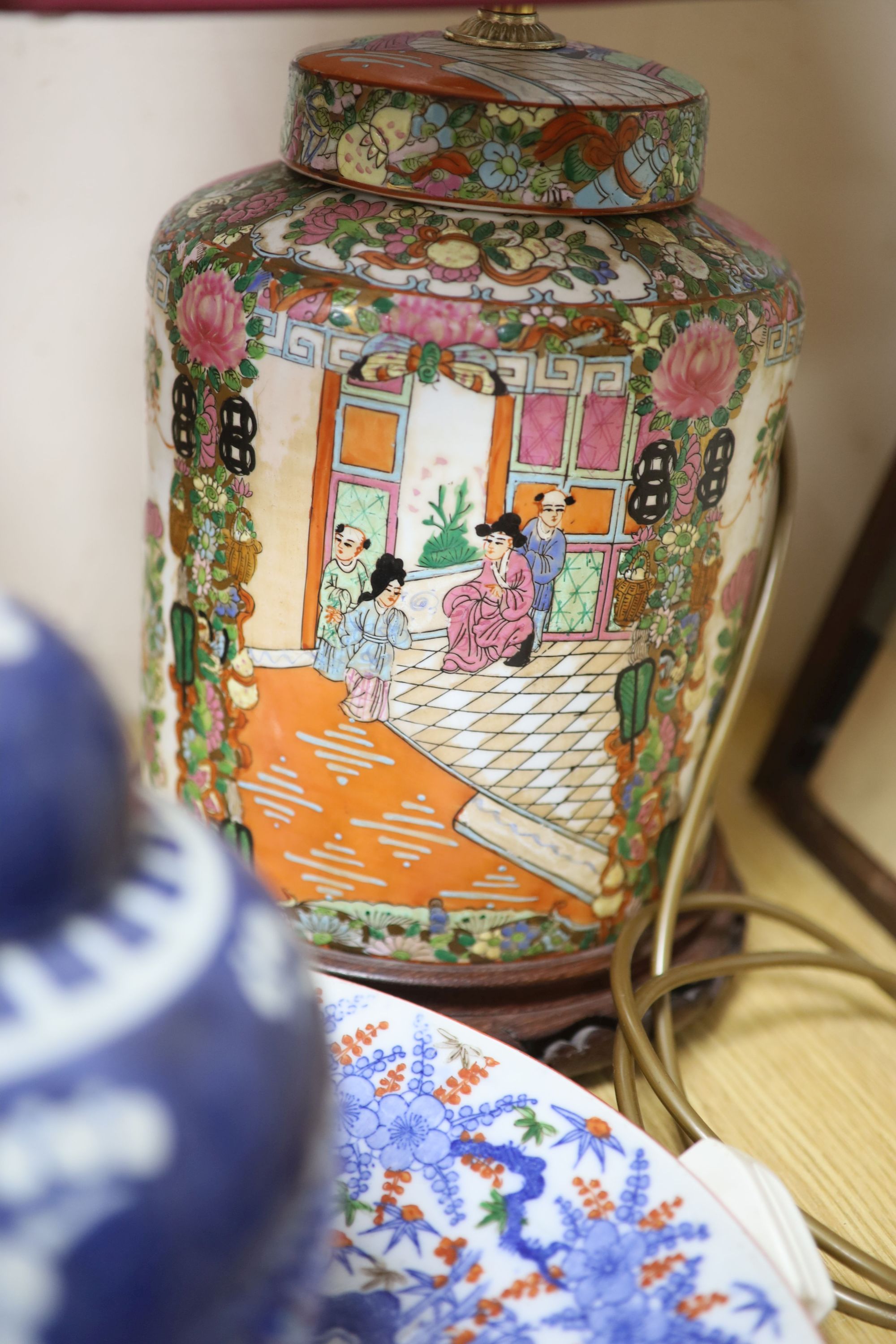 A pair of Chinese famille rose table lamps, 35cm high to lamp fitting, a blue and white jar and cover, a dish and a horse print